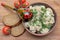 Russian cuisine: dumplings on a plate, cherry tomatoes and bread