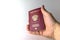 Russian document. The hand holds the Passport. Russian passport for foreign travel