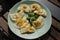 Russian dumplings pierogi, pelmeni with onion and butter