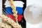 Russian flag, Ukrainian wheat and world globe lie on a white background, world famine, theft of Ukrainian grain by