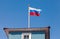 Russian flag waving in the wind over sky