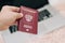 Russian foreign international passport in the hand citizen. Russian citizenship, passport and rights concept