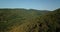 Russian Forest And Mountains Under Blue Sky By Aerial Drone.