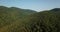 Russian Forest And Mountains Under Blue Sky By Aerial Drone.