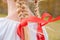 Russian girl Slavic appearance with braids with red ribbons in t