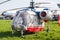 Russian helicopter standing on the grass with the engine OFF