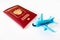 Russian international passport and a blue plane on white background. Travel, journey and flying concept
