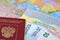 The Russian international passport, euro and the Lithuanian simplified transit document by rail (UPD ZhD) lie on the pol