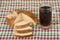 Russian kvas in mug and slices of bread on tablecloth