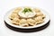 Russian meat dumplings pelmeni. Boiled dumplings with greenery dill and sauce. Cooking dough products with meat