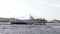 Russian modern military warship at the parade in Saint Petersburg in the Neva River and tourist boats