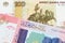 A Russian one hundred ruble note paired with a colorful fifty pound bank note from Sudan.