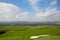 Russian open space. field, forest, sky, road. golf course top view