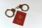 Russian passport and handcuffs on white background. prohibition of Russian citizens on entry and exit. passport lock