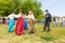 Russian peasant women lead dance to the accordion music for the audience