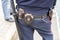 Russian policeman with gun belt, handcuffs gun