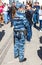 Russian policewoman with gun belt, handcuffs gun, shoker and holster