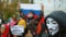 Russian protest in Khabarovsk. Anonymous mask Guy Fawkes activist marches on.