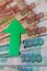 Russian rouble banknotes with green arrow grow up economics stock exchange