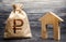 Russian ruble RUB symbol money bag and house. Real estate purchase and investment. Affordable loan, mortgage. Taxes, rental income