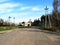 Russian rural landscape with empty countryside dirt wet road