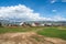 Russian siberian village with dirt road and traditional ancient wooden houses. Wooden houses in an old Siberian Kurai village