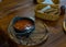 Russian soup, borsch, in a cast iron pot on the background of rye bread