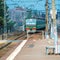 Russian suburban passenger train arriving to station