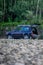 Russian SUV Lada Niva 4x4 on the riverside