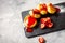 Russian syrniki or cottage cheese fritters or pancakes served with strawberry on concrete background