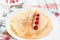 Russian thin pancake with raspberries