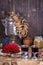 Russian traditional kettle samovar on the wooden table. Black tea, bagels, red viburnum, jam and russian samovar in the rustic sty