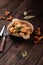 Russian traditional meal homemade dumplings stuffed with chanterelle mushrooms in a bowl on a dark wooden background, national