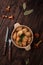 Russian traditional meal homemade dumplings stuffed with chanterelle mushrooms in a bowl on a dark wooden background, national