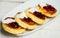 Russian traditional syrniki cottage cheese pancakes breakfast on the plate. Russian cheesecakes with raisins on a white plate. Che