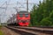 Russian train in the summer. The train is coming to the station. railway. Russia, Leningrad region, Peterhof, June 20