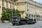 Russian truck tractor KAMAZ-65225 with a Soviet t-34-85 tank on a semi-trailer goes down the street of Moscow after the Victory pa
