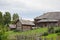 Russian village in summer. Country yard with old log houses