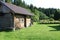 Russian wooden bathhouse at edge of forest