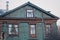 Russian wooden house with carved platbands on the windows