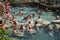 Russians and other tourists swim in the thermal pools