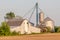 Rust barn and silos in agriculture farmland.