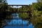A Rust Colored Trestle Railroad Bridge Crosses the Royal River