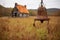 rust-covered antique farm bell in a rural setting