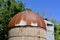 Rust metal roof and chute of a silo