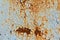 Rust, rusty background, rusty metal texture with remnants of blue paint, rust protruded through the paint