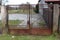Rusted backyard metal locked gates