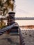 Rusted bollard rope in harbor