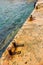 Rusted bollards  on  a concrete pier