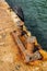 Rusted bollards  on a concrete pier